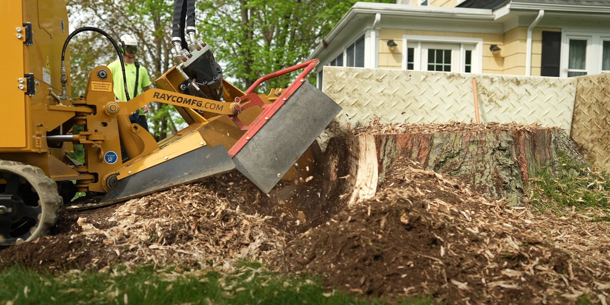 Professional stump grinding machine removing tree stump in Laredo, TX